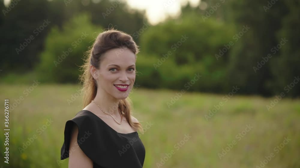 Beautiful young woman smiling in nature. Outdoors portrait Beautiful young woman smiling in nature. Outdoors portrait