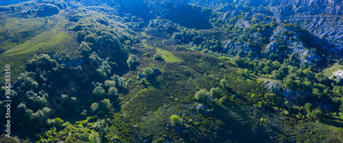 Aerial view of the beech and karst. Sierra de Hornijo Mountain Range close by San Pedro de Soba village in Soba Valley, within Pasiegos Valleys and Alto Ason Natural Park of Cantabria in Spain. Europe