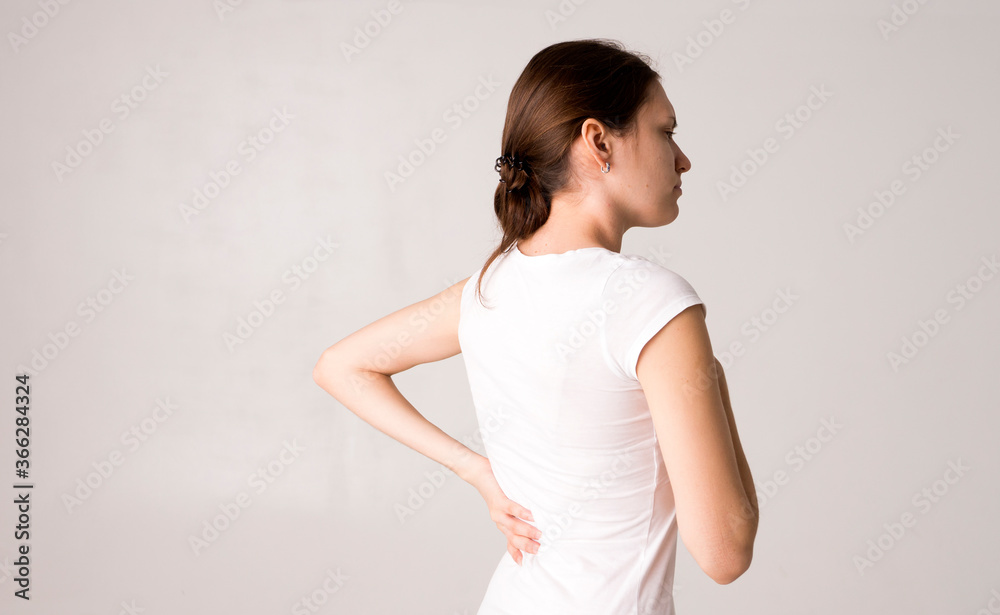 Tired woman feeling pain, massaging tense muscles Tired woman feeling pain, massaging tense muscles