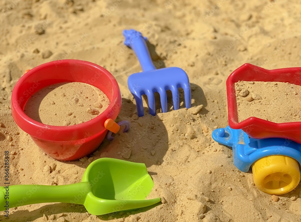 Toys shovel, rake and bucket for children's sandbox. Children's toys. Toys shovel, rake and bucket for children's sandbox. Children's toys.