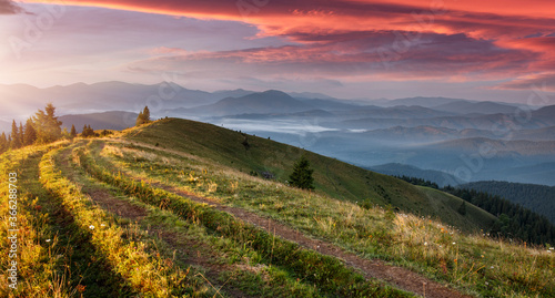 Impressive countryside landscape in morning light at mountains. Wonderful summer scenery during sunrise. Amazing sunset in the mountains with dramatic, colorfull sky. Carpathian, Ukraine, Europe.