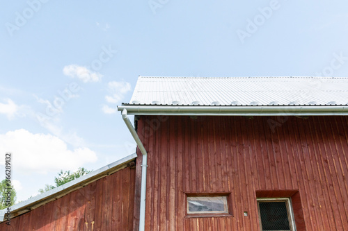 red barn with sheet metal roof