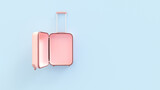 Open empty pink suitcase luggage bag on blue background. Travel concept mockup with copy space. Top view.