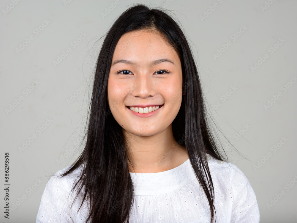 Portrait of happy young beautiful Asian woman Portrait of happy young beautiful Asian woman