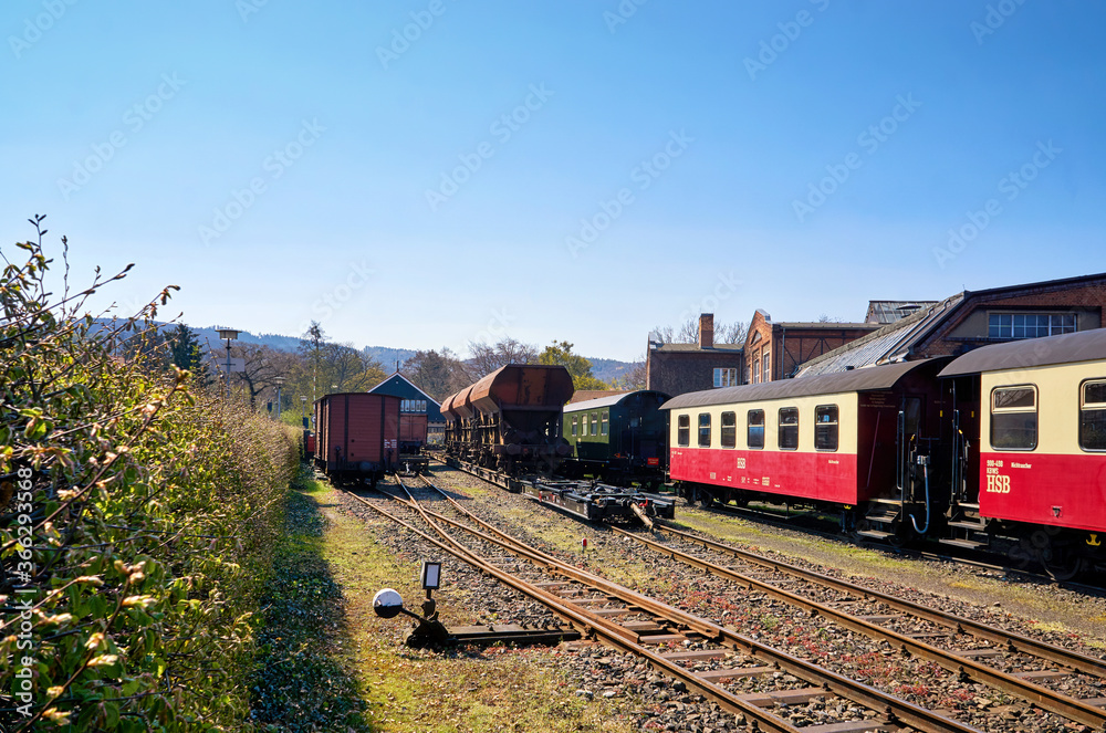 Railway station with the narrow-gauge railway network and railway wagons. Brockenbahn in the Harz Mountains.