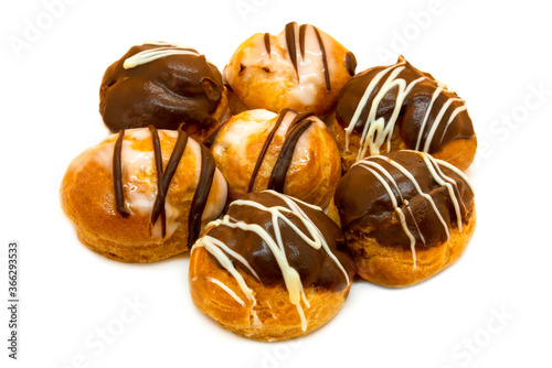 Seven profiteroles with cream and chocolate