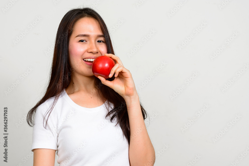 Portrait of happy young beautiful Asian woman Portrait of happy young beautiful Asian woman