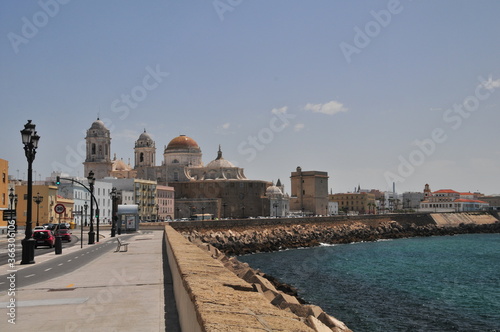 Cádiz Cathedral in the midday summersun, Malecón Havana-style coastal promenade, Andalusia, Spain photo