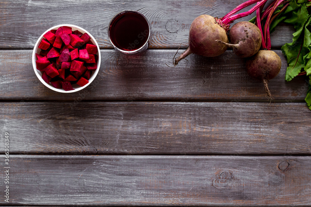 Sliced beet and juice on wooden table top view copy space Sliced beet and juice on wooden table top view copy space