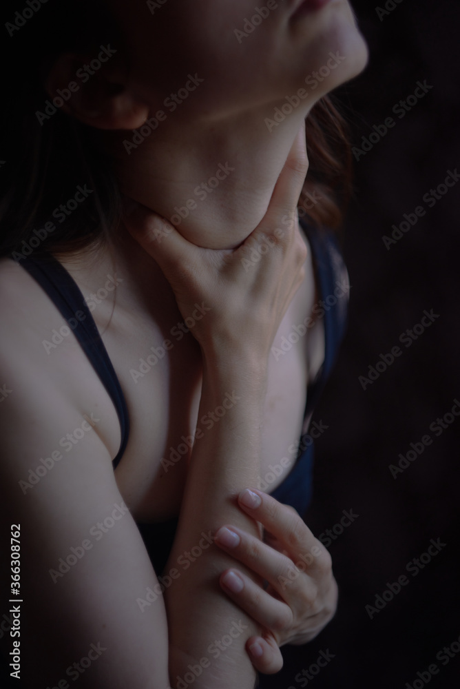 A girl with black hair in black underwear sits on a chair by the window A girl with black hair in black underwear sits on a chair by the window