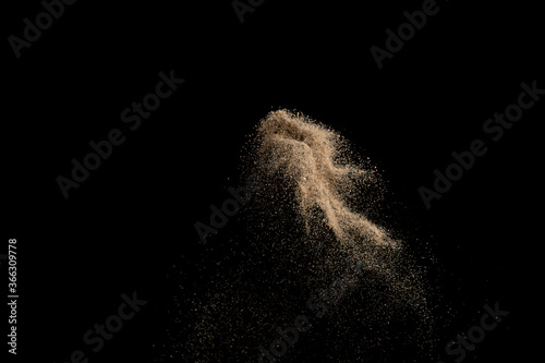 Abstract sand explosion art on black background  sand splash.