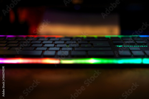 black computer keyboard with colourful lighting 