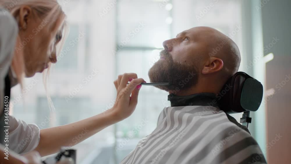 Sweet Barbershopper Combs Thick Beard of a Man. Sweet Barbershopper Combs Thick Beard of a Man.