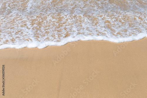 White wave on fine sand beach, summer outdoor day light, nature and environmental concept background