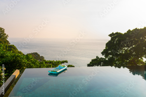 Private villa with swimming pool of the luxury resort with blue inflatable mattresses
