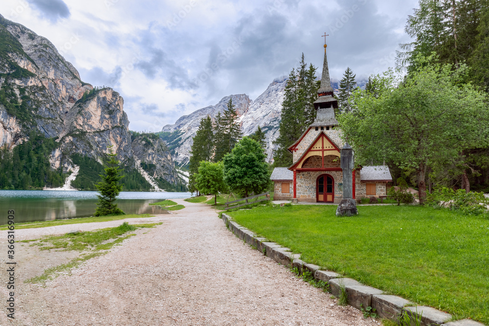 Evening view of the famous Lake Braies and the little chapel (Kapelle Pragser Wildsee)