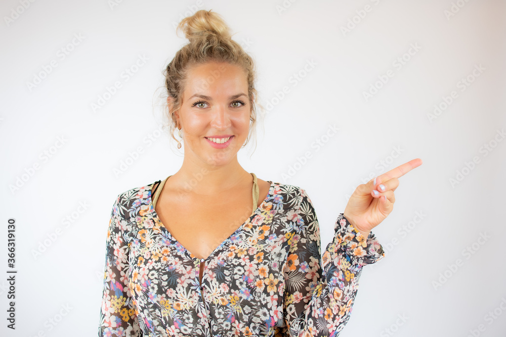 Pretty blonde woman in a flowery dress on white background Pretty blonde woman in a flowery dress on white background