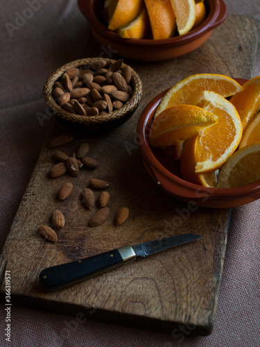 Rustic simple oranges and almonds with vintage pocket knife.