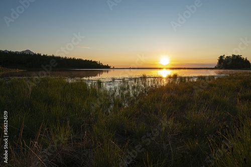 Sunrise on the waters of the lake