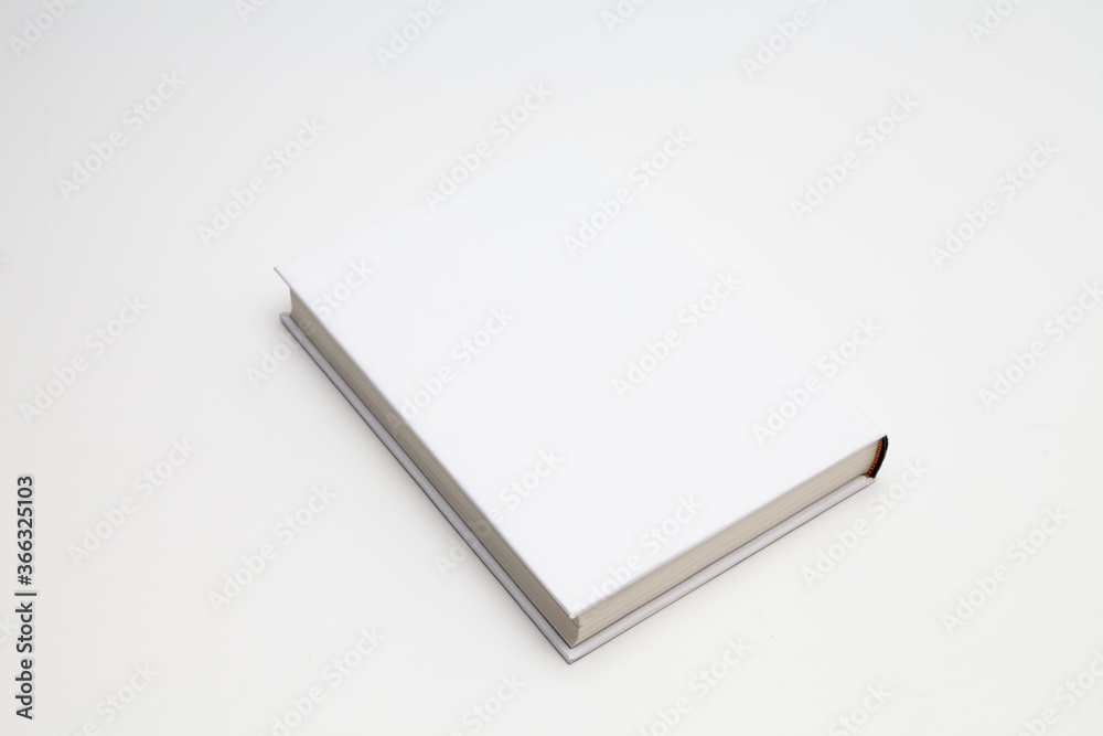 White book with no title standing on white background White book with no title standing on white background