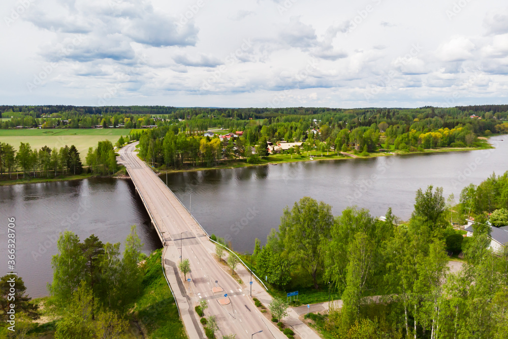 Fototapeta premium Aerial panoramic view of bridge in city Inkeroinen at river Kymijoki, Finland.