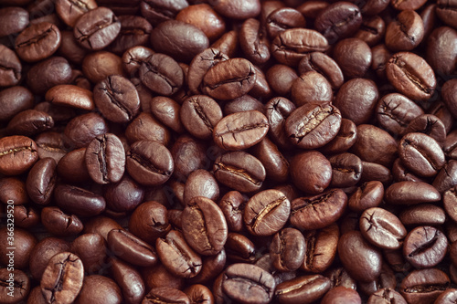 arabica coffee beans brown background
