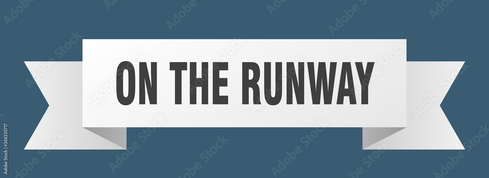 on the runway ribbon. on the runway paper band banner sign on the runway ribbon. on the runway paper band banner sign