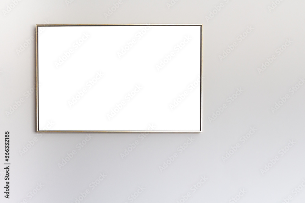 Thin picture frame on a gray wall. Isolated. Place for text or picture. High quality photo