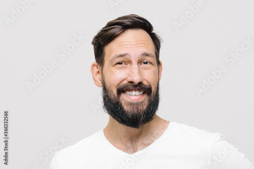 happy young man in the studio on a white background