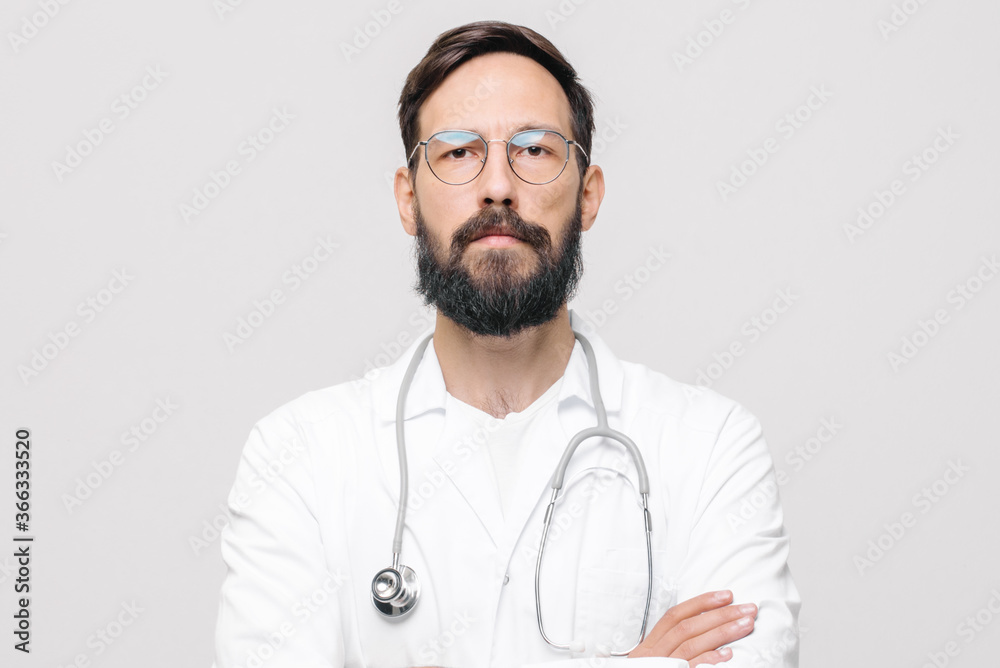 close-up portrait of young male doctor in uniform with stethoscope. medical concept close-up portrait of young male doctor in uniform with stethoscope. medical concept