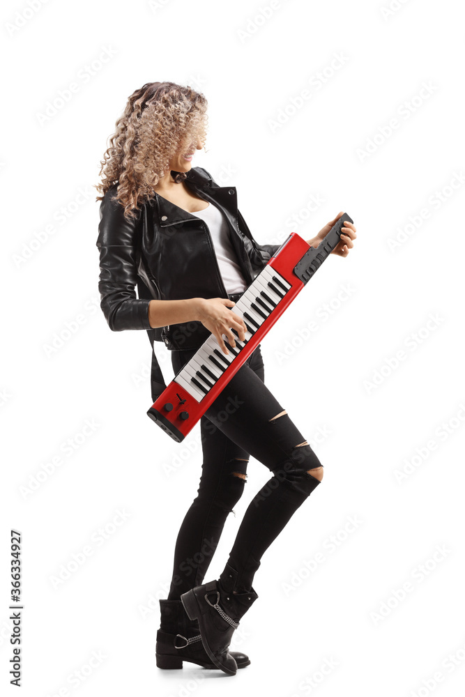 Woman playing a red keytar synthesizer