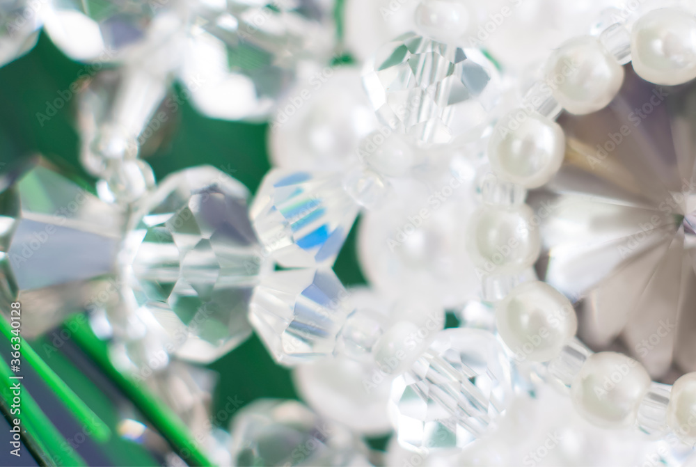 Background of abstract glittering lights. Blurred crystal beads for the background. de-focus. Use it as a background for your presentation. Background of abstract glittering lights. Blurred crystal beads for the background. de-focus. Use it as a background for your presentation.