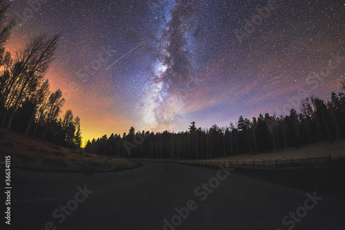 Milky Way in the night sky with a shooting star in Flagstaff, Arizona photo