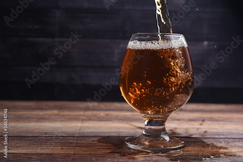 glass of beer on dark background