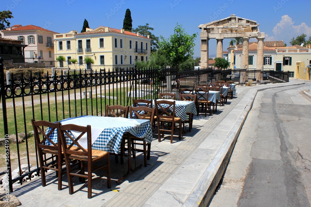 Greece, Athens, July 16 2020 - Empty chairs and tables of a traditional restaurant in the touristic district of Plaka. 
