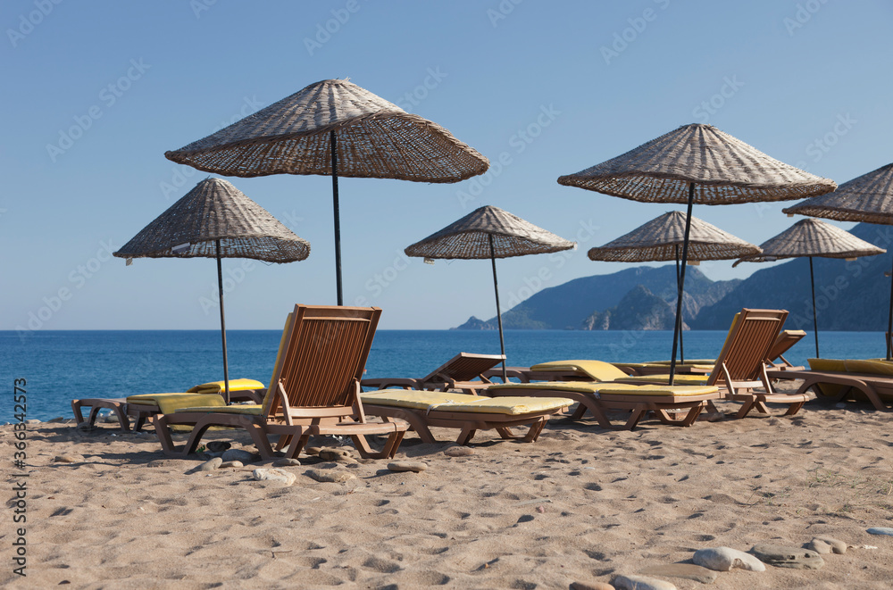 Beach Umbrellas with Sun Loungers on Beach