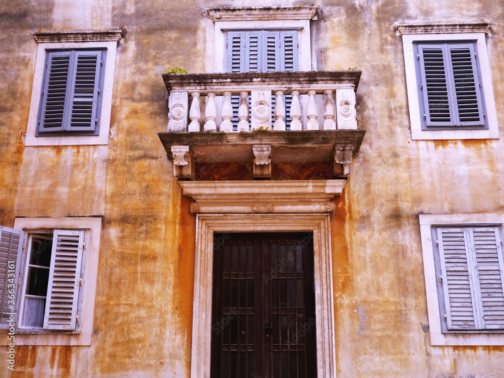 Obraz premium Old Rustic Residential Building with Window Shutters and a Balcony, Zadar, Croatia