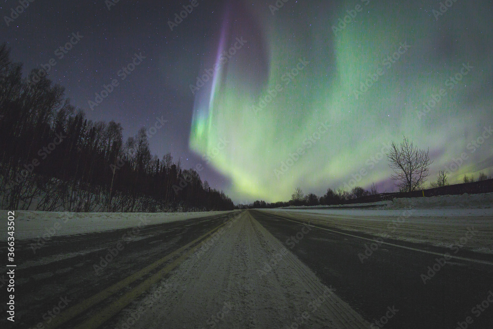Aurora Borealis over a highway in Alaska