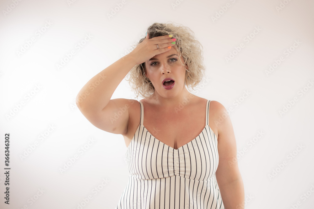 Blonde young woman with the gesture of headache Blonde young woman with the gesture of headache