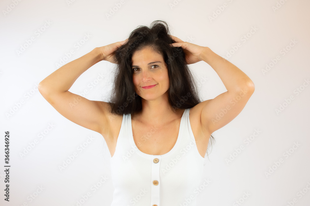 Fototapeta premium Pretty young woman with long black hair making gesture