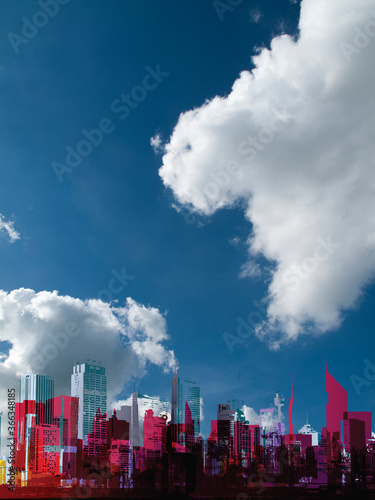 Generic silhouetted stylized urban city skyline set against a blue cloudy sky