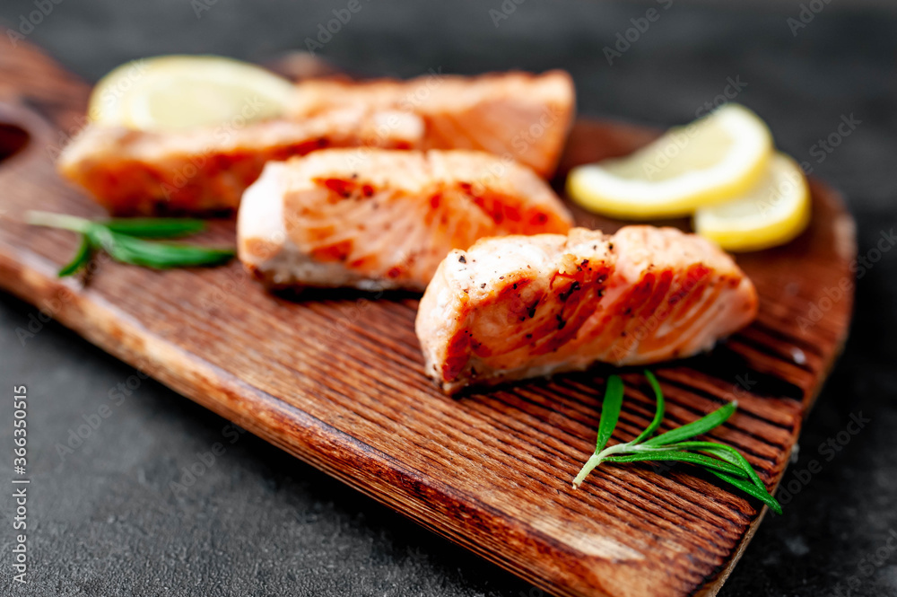 grilled salmon slices on stone background
grilled salmon slices on stone background