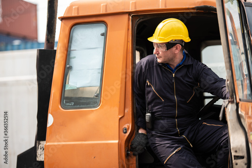 Delivery container truck driver at cargo shipping port.