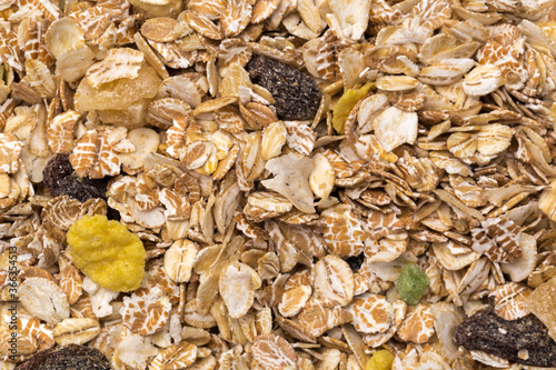 oatmeal with raisins, coconut, pineapple and banana slices isolated on a white background. For packing oatmeal or granola.