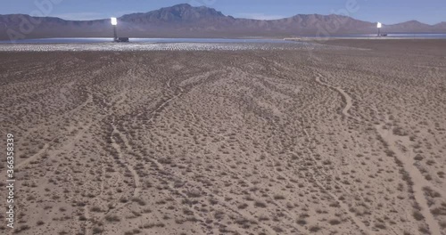 Aerial of Solar Power Plant in Nevada California Desert with Mountains in Horizon and Clear Blue Sky - Ivanpah Solar Electric Generating System