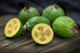 Fresh feijoa close-up on a wooden background. Selective focus