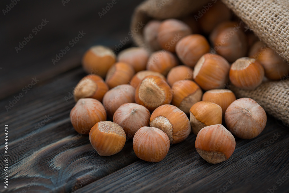 Hazelnuts on a wooden dark background close-up. Hazelnuts on a wooden dark background close-up.