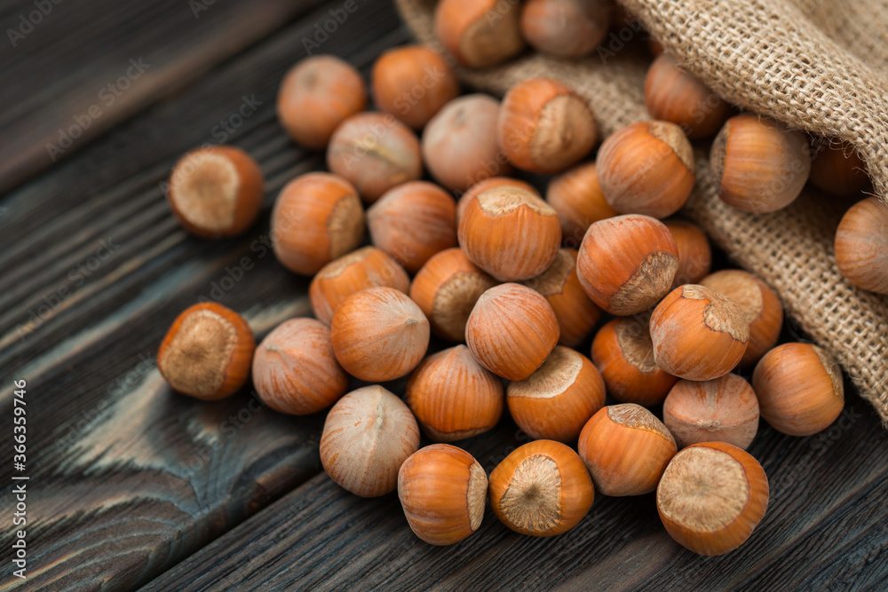 Hazelnuts on a wooden dark background close-up. Hazelnuts on a wooden dark background close-up.