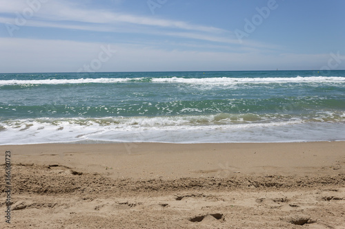 Beach view in summer sunny day in Calafell,Spain ,Mediterranean Sea.Holidays background.Travel concept