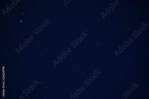 Starry sky in the summer in the village shot on the lens Helios 44